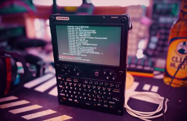 UConsole surrounded by cables, club mate and keyboards 