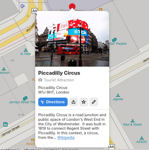 Showing Piccadilly Circus in London in GNOME Maps with the icon in the button for directions having the "take an exit" pointing left.