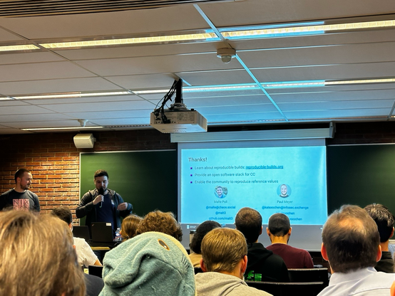My colleagues Paul and Malte showing their „thanks for listening slide“ at the talk